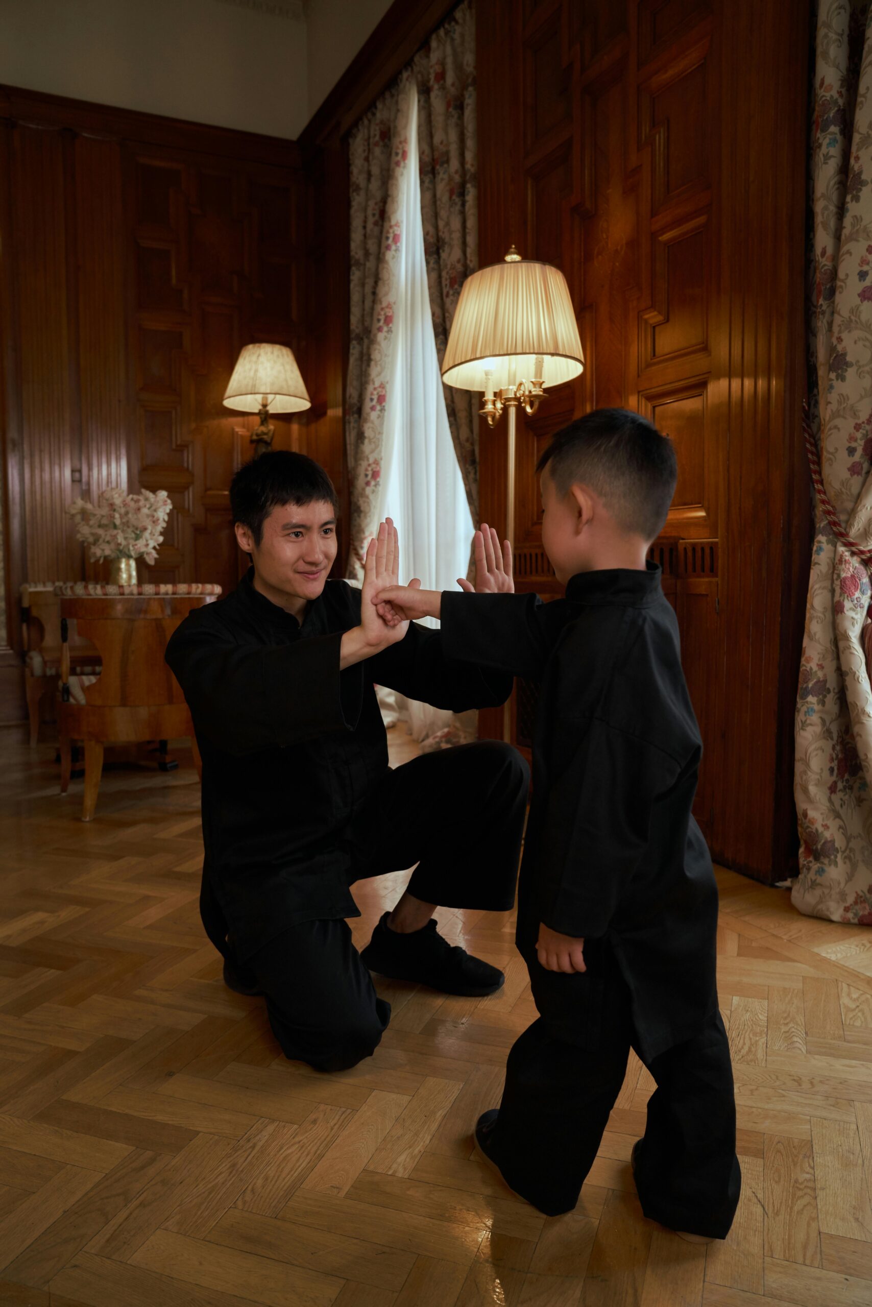 Person practicing kung fu at home in traditional attire
