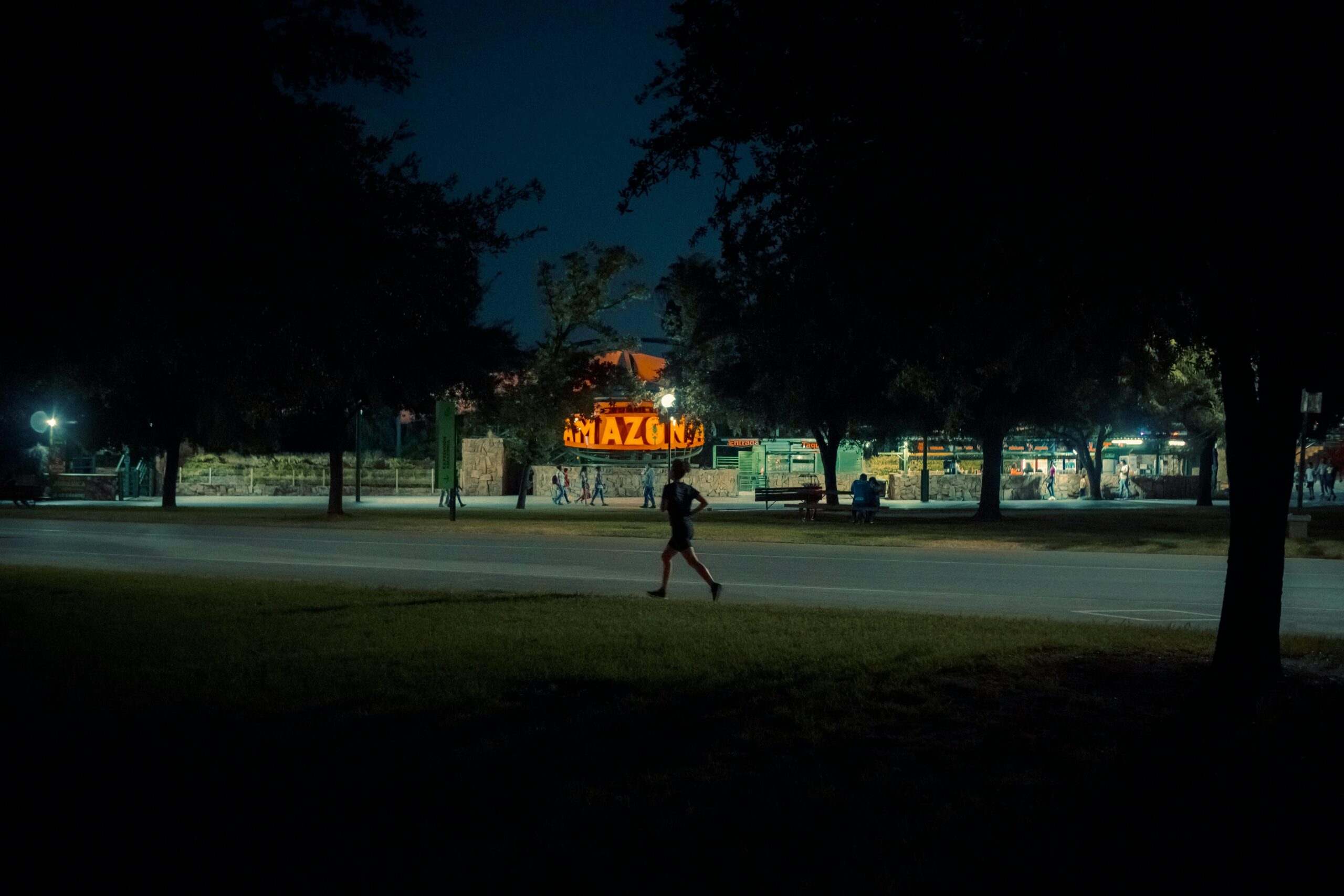Person jogging at night demonstrating night exercise benefits